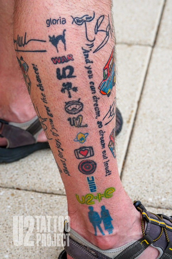 Leg sleeve of U2 fan tattoos.
